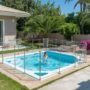 lucid origin_Small_family friendly_splash_pool_with_visible_safety_fencing_and_slip resistant 0 90x90